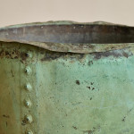 A large riveted verdigris copper