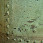 A large riveted verdigris copper