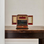 A fine, small early Victorian tooled and gilt leather correspondence table cabinet