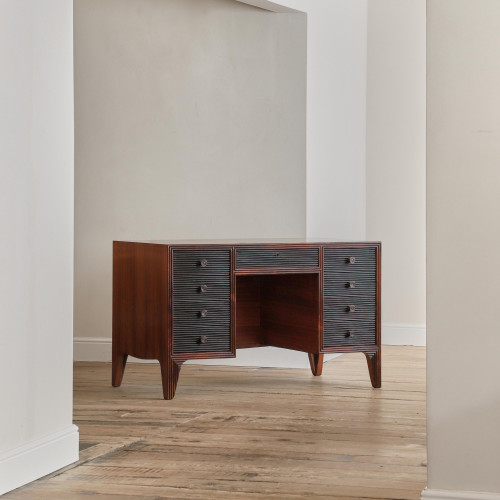 A rosewood veneered and stained walnut 'grissinato' desk by Paolo Buffa (1903 - 1970) and made by Mario Quarti (1901 - 1974)
