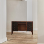 A rosewood veneered and stained walnut 'grissinato' desk by Paolo Buffa (1903 - 1970) and made by Mario Quarti (1901 - 1974)