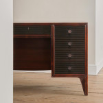 A rosewood veneered and stained walnut 'grissinato' desk by Paolo Buffa (1903 - 1970) and made by Mario Quarti (1901 - 1974)