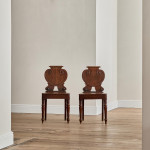 A pair of George IV oak hall chairs