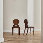 A pair of George IV oak hall chairs