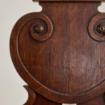 A pair of George IV oak hall chairs