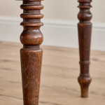 A pair of George IV oak hall chairs