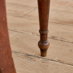 A pair of George IV oak hall chairs