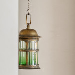 An Arts & Crafts gilt brass hall lantern