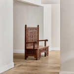A fine Arts & Crafts carved oak settle in the manner of Bruce Talbert (1838 - 1881)
