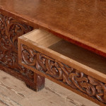 A fine Arts & Crafts carved oak settle in the manner of Bruce Talbert (1838 - 1881)