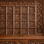 A fine Arts & Crafts carved oak settle in the manner of Bruce Talbert (1838 - 1881)