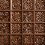 A fine Arts & Crafts carved oak settle in the manner of Bruce Talbert (1838 - 1881)