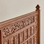 A fine Arts & Crafts carved oak settle in the manner of Bruce Talbert (1838 - 1881)