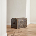 A black leather studded domed trunk