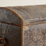A black leather studded domed trunk