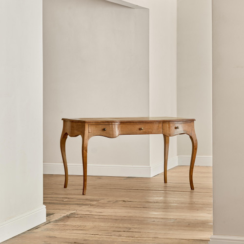 A Louis XV style oak bureau plat en arbalète