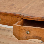 A Louis XV style oak bureau plat en arbalète