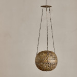 A brass shadow ball pendant