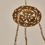 A brass shadow ball pendant