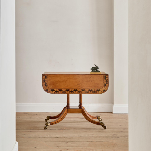 A Regency satinwood pembroke table