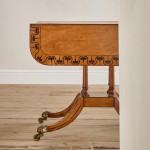 A Regency satinwood pembroke table