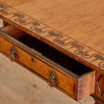 A Regency satinwood pembroke table