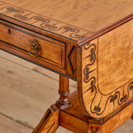 A Regency satinwood pembroke table