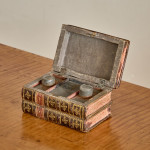 A small and fine George III leather and paper tea caddy