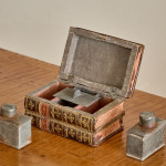 A small and fine George III leather and paper tea caddy