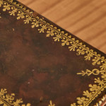 A small and fine George III leather and paper tea caddy