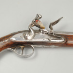A fine pair of silver mounted holster pistols by Collumbell