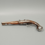 A fine pair of silver mounted holster pistols by Collumbell