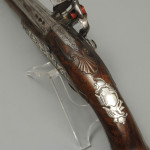 A fine pair of silver mounted holster pistols by Collumbell