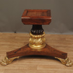 A Regency rosewood and parcel gilt centre table