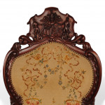 Armorial carved mahogany armchair