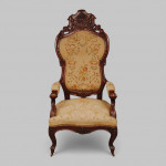 Armorial carved mahogany armchair