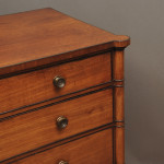 A Regency mahogany chest with ebony cock beadings