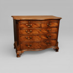 A fine and unusual Lancashire mahogany serpentine chest
