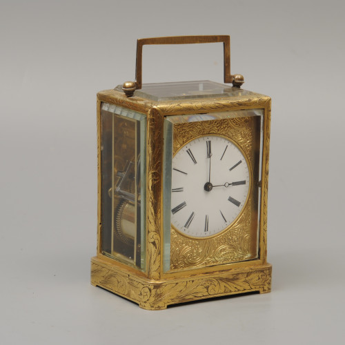 An early carriage clock in a gilt-engraved gorge case