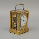 An early carriage clock in a gilt-engraved gorge case