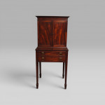 A George III period mahogany writing cabinet on stand