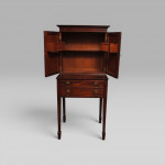 A George III period mahogany writing cabinet on stand