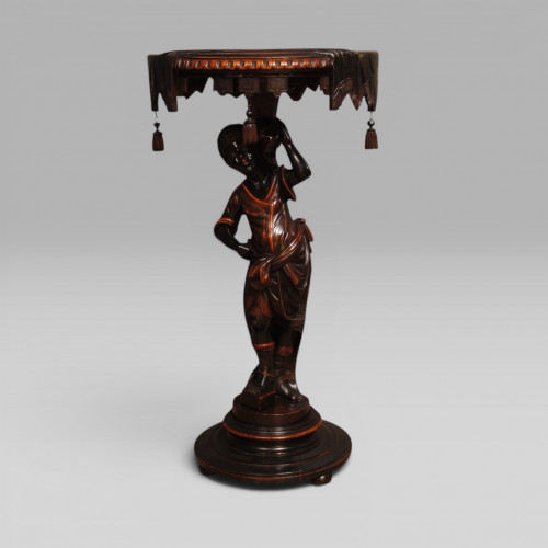 A Venetian carved and polychromed Blackamoor table
