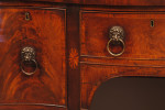 A fine small George III period mahogany serpentine sideboard