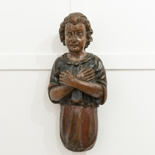 A 17th century carved walnut and polychrome-decorated angel, Italian, circa 1600-50