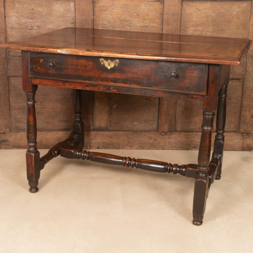 A George II solid yew wood writing table, circa 1730-50