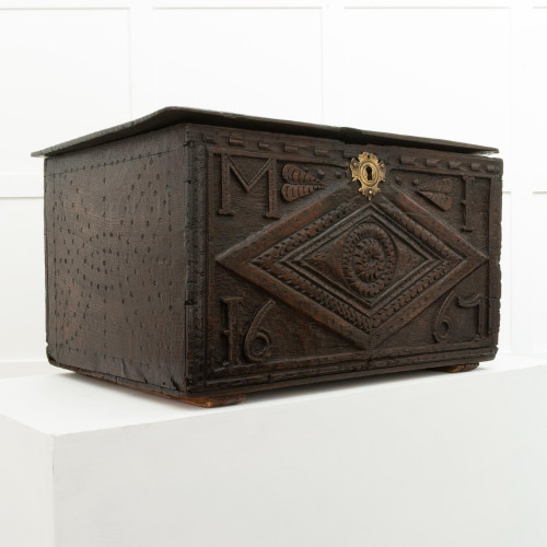 A Charles II carved oak boarded box, Lancashire, dated 1667
