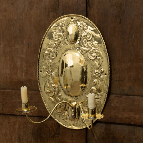 A sheet-brass twin-branch wall sconce, English, circa 1900