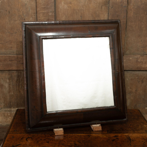 An 18th century walnut cushion-moulded mirror, English