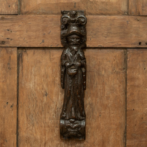 A rare Elizabeth I carved oak figural pilaster, circa 1570